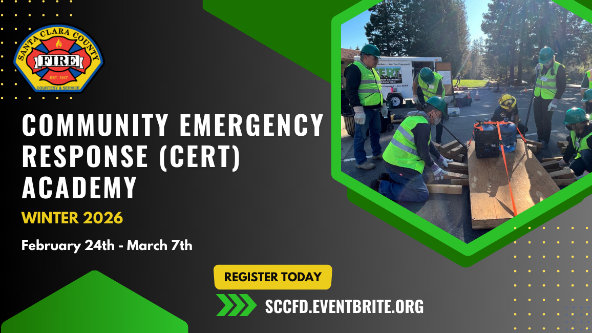 Men wearing safety helmets and vests standing and kneeling holding pieces of wood